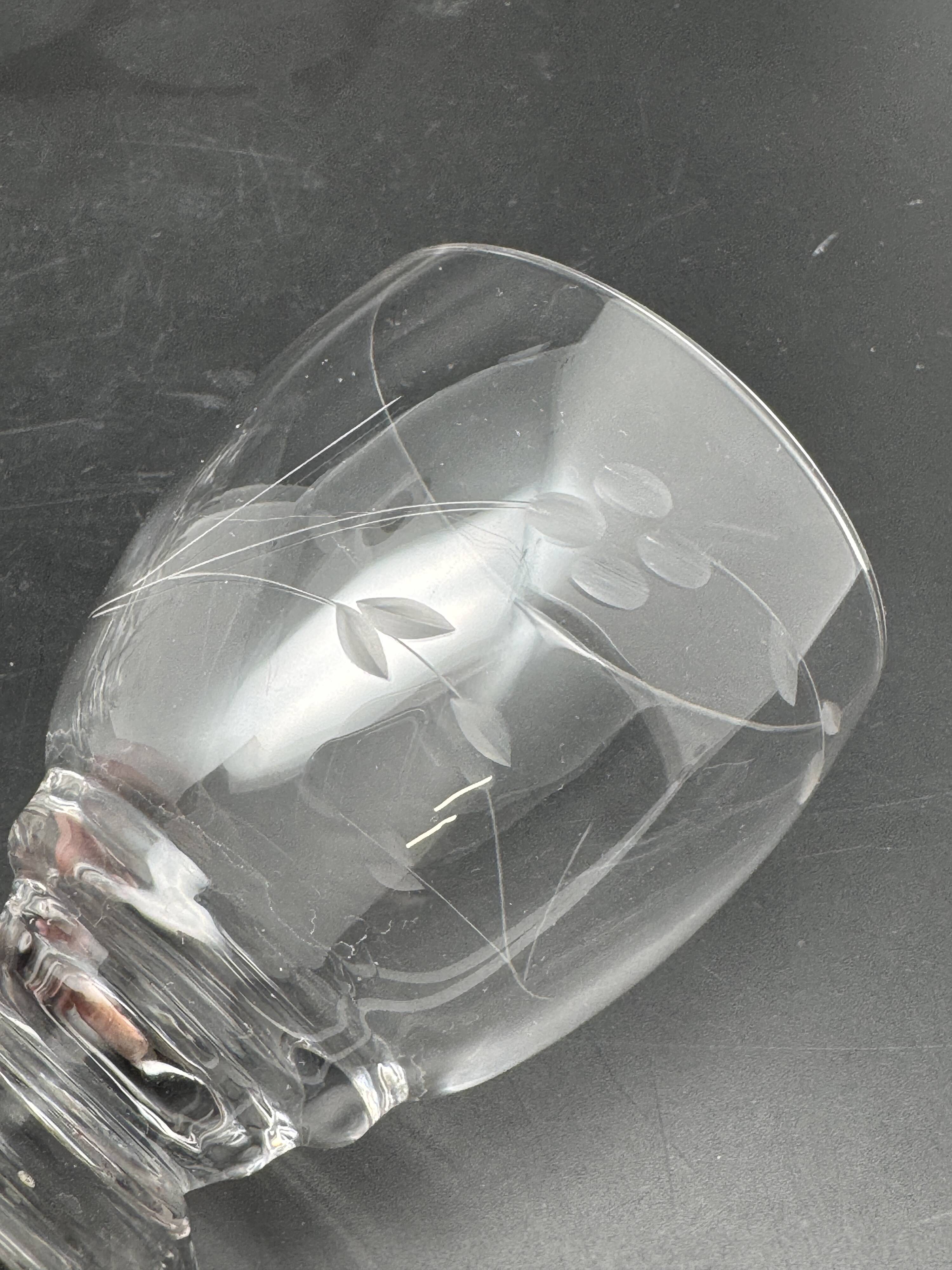 Set of fine glass stemmed glasses with small flower patterns