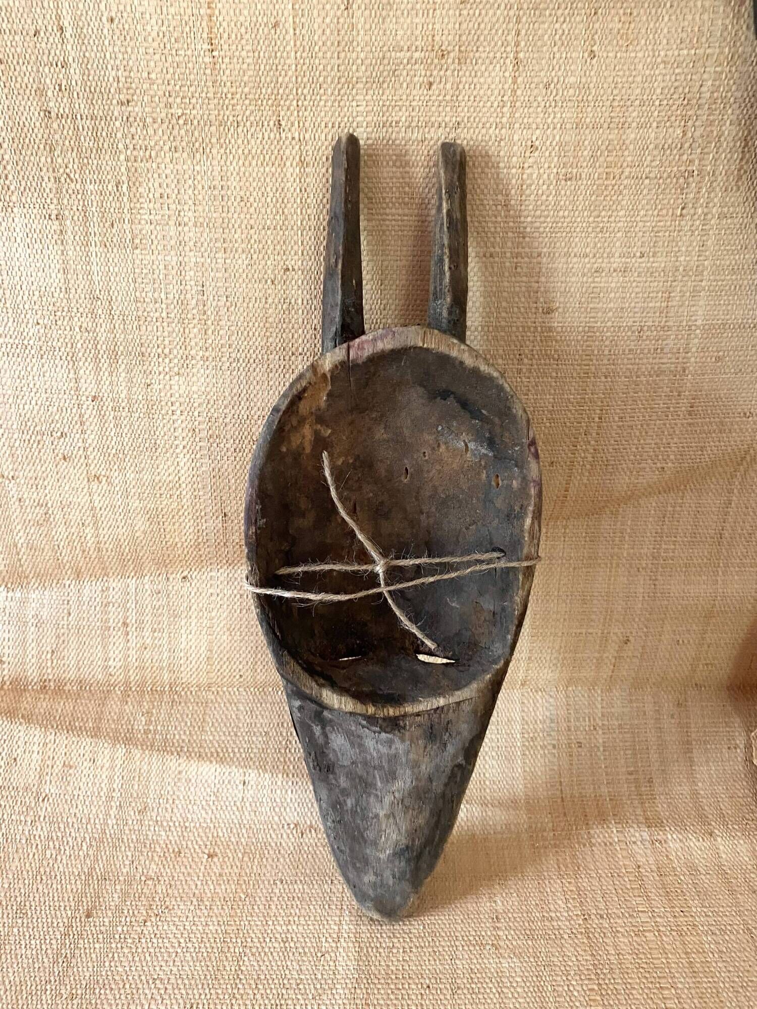 Ancient wooden and brass mask
