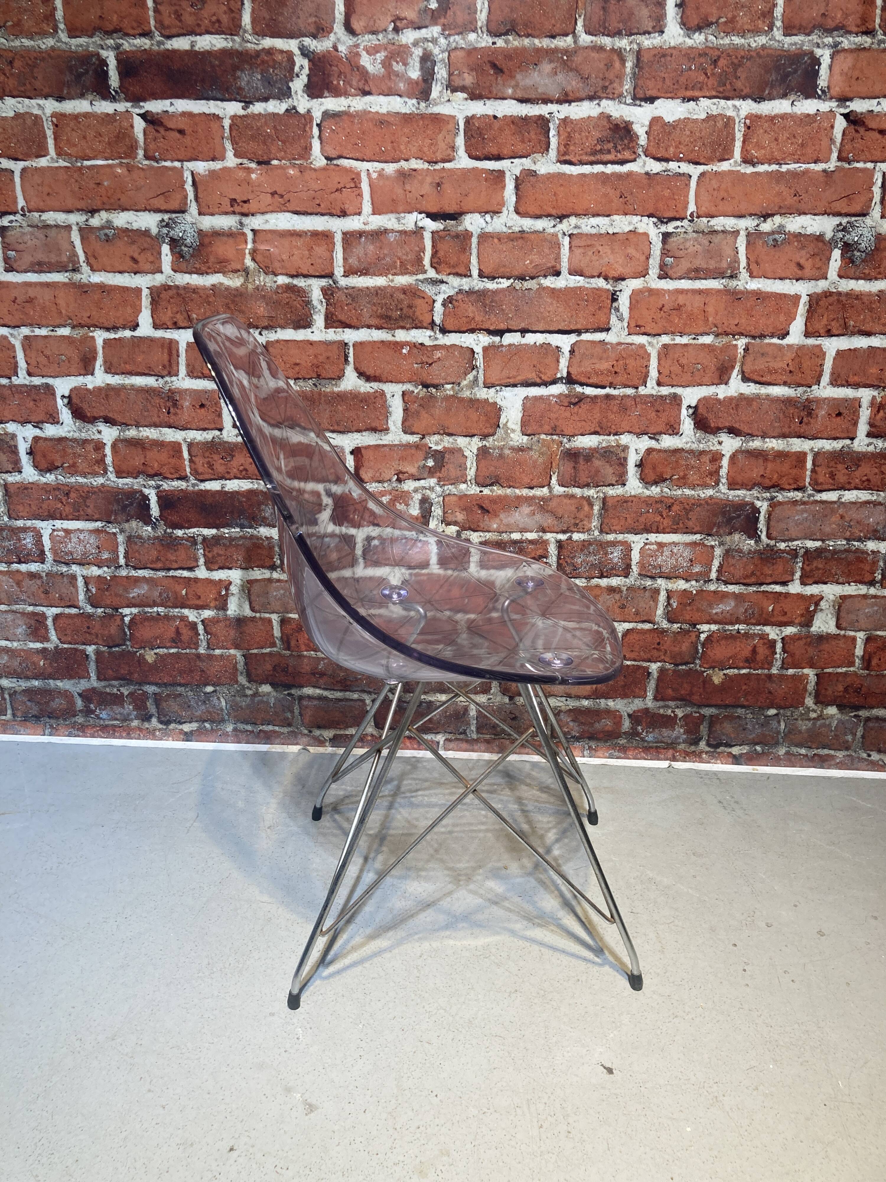 Set of four plexiglass and metal chairs