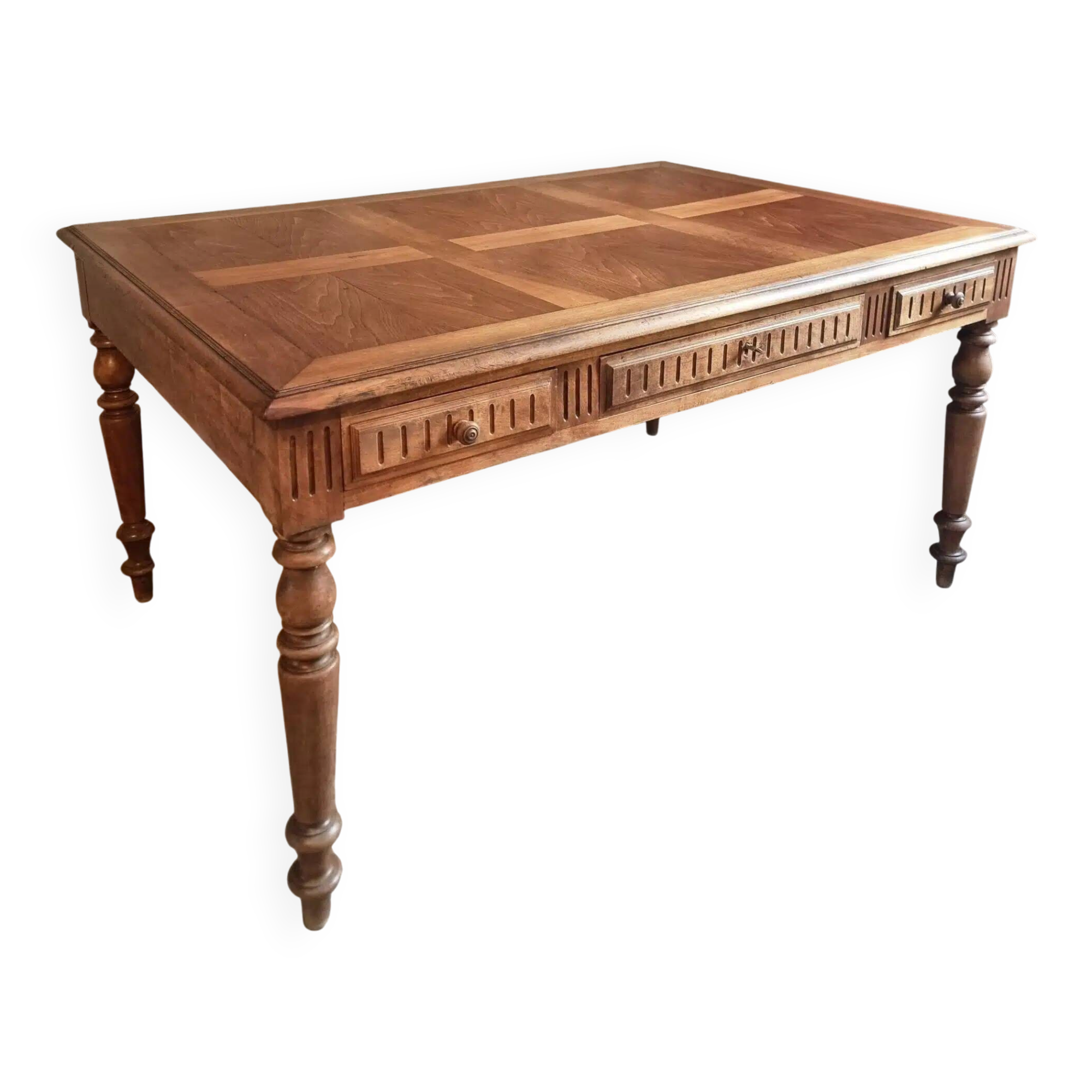 Antique French walnut table with six drawers, parquet top, early 20th century.
