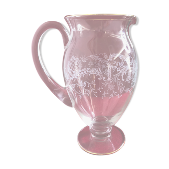 Golden led glass pitcher and floral decoration