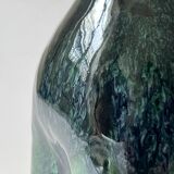 Ceramic vase with a glazed blue/green finish.