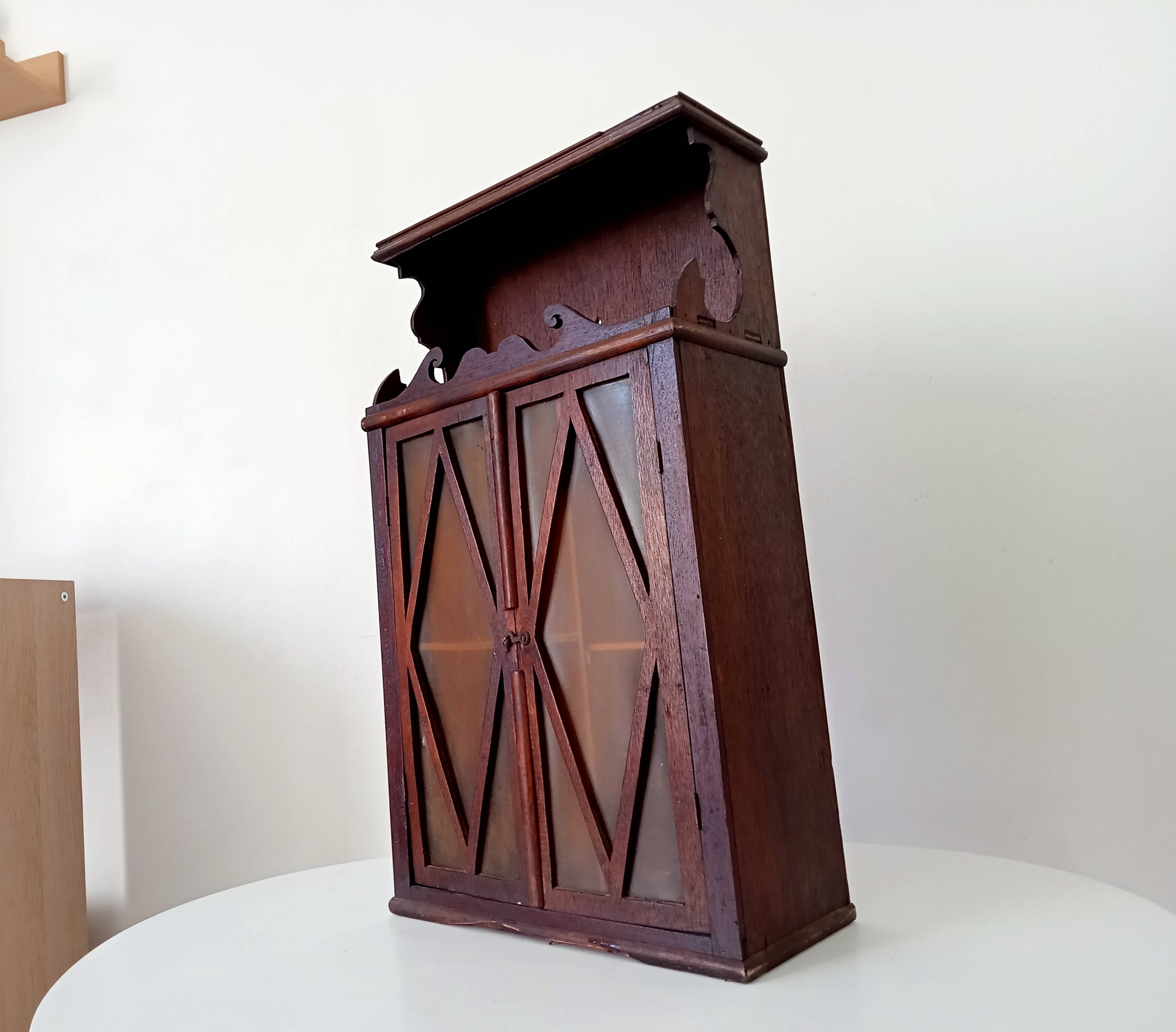 Small antique wall cabinet in Gothic style.