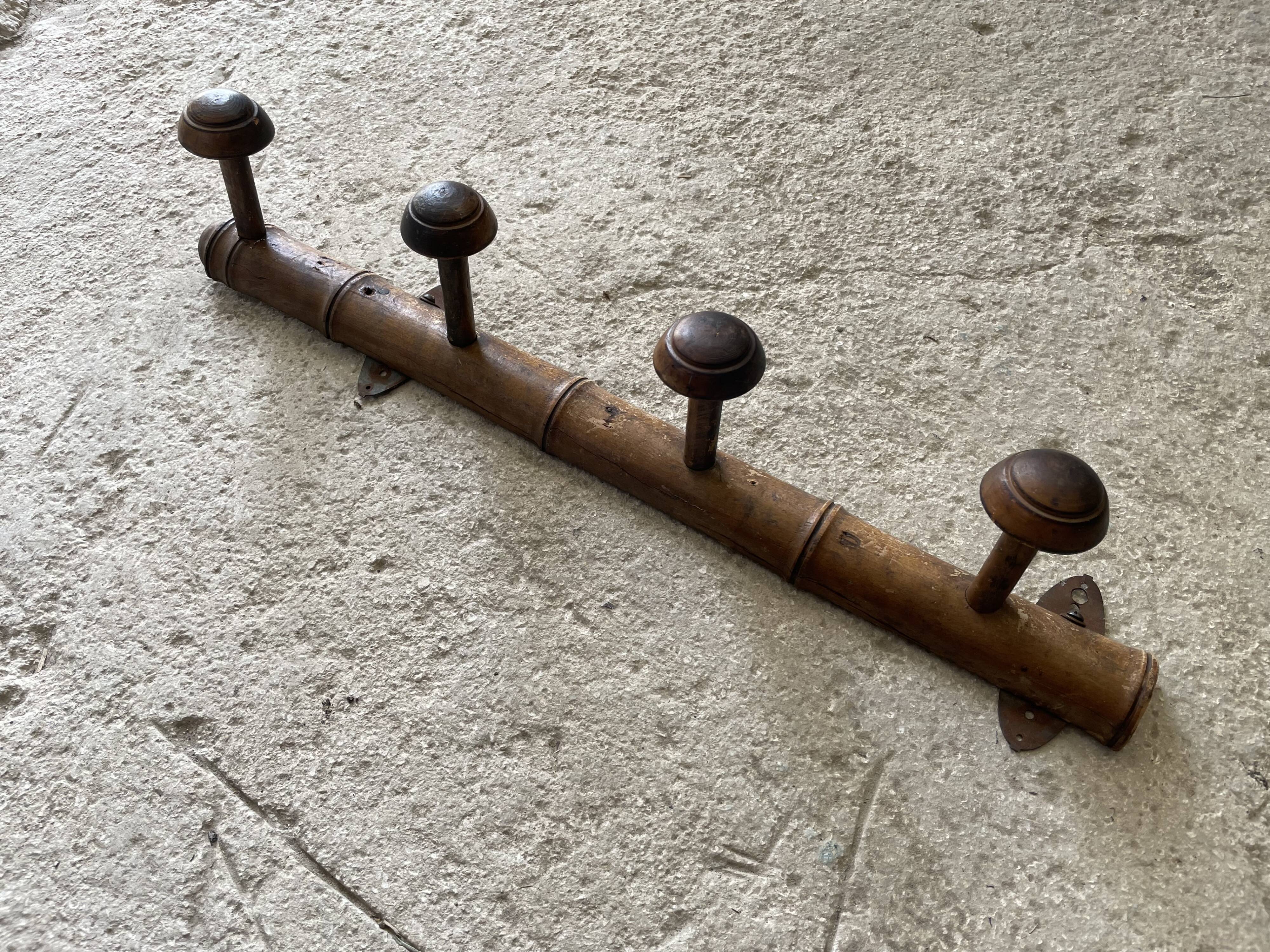 Old wooden wall coat rack