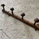 Old wooden wall coat rack