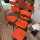 4 red formica chairs