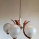 Scandinavian suspension in teak, glass, and metal.