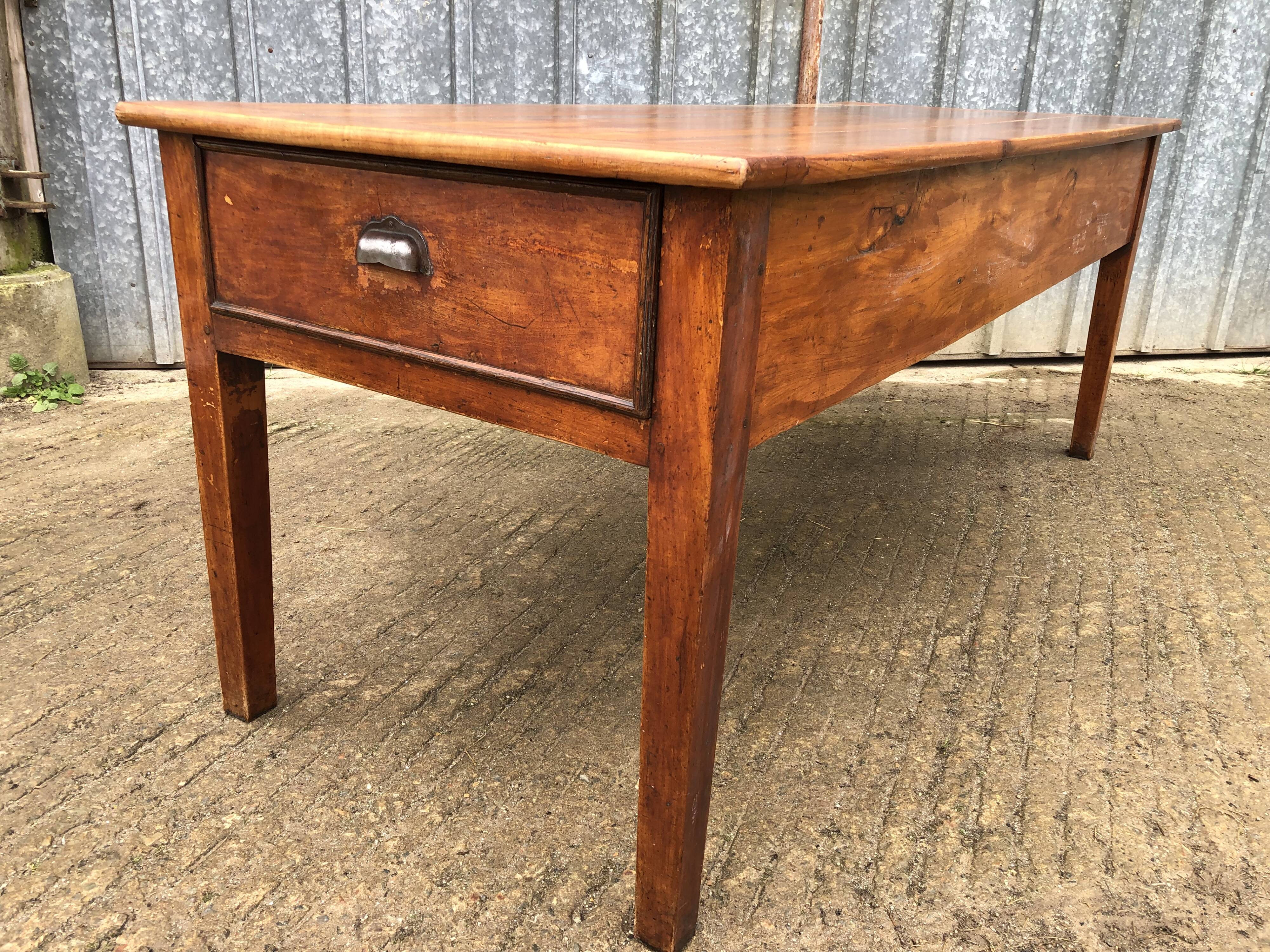 Antique farmhouse table in solid cherry wood with 3 drawers and 1 pull-out.