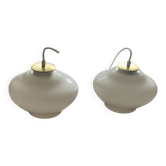 Pair of pendant lights with white glass shades from the 1950s.