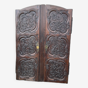 Antique carved wooden cabinet doors.