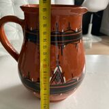 Terracotta ceramic carafe with geometric and white patterns