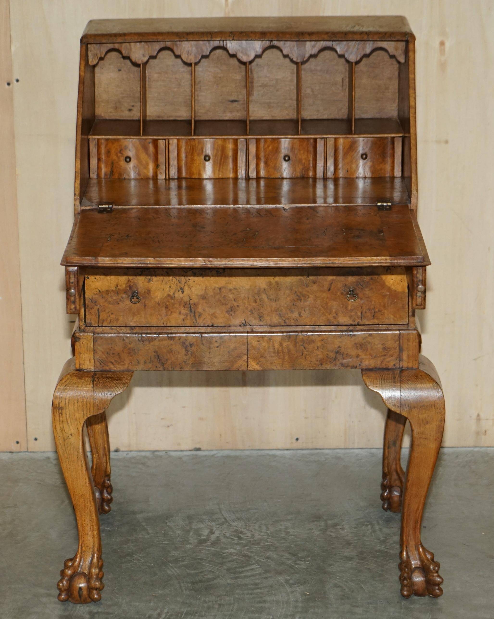 Writing desk in pollard oak from around 1800 with claw and ball carved legs.