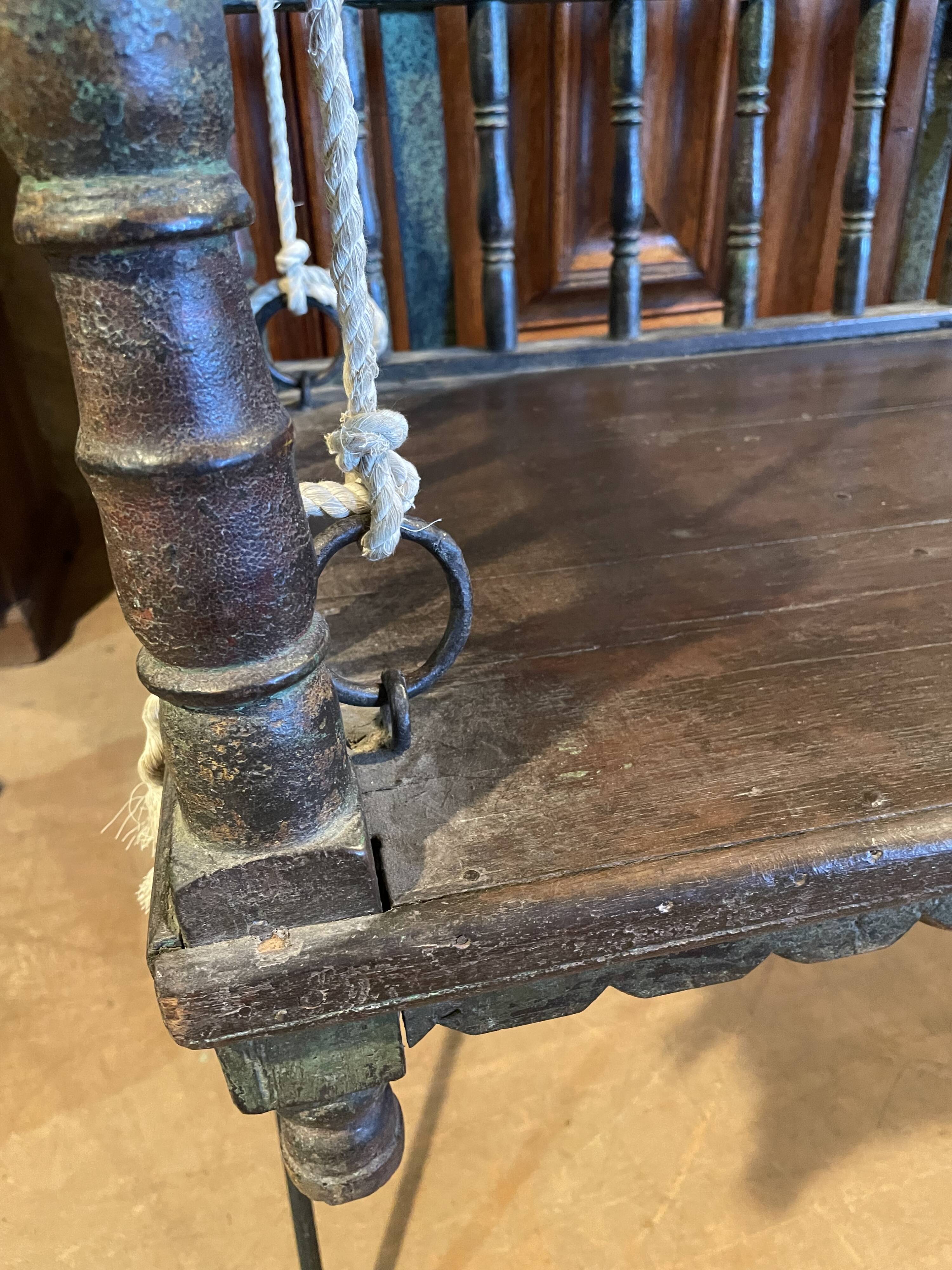 Black lacquered teak rocking chair