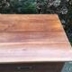 Old farmhouse table with cherry and chestnut panels with 3 drawers.