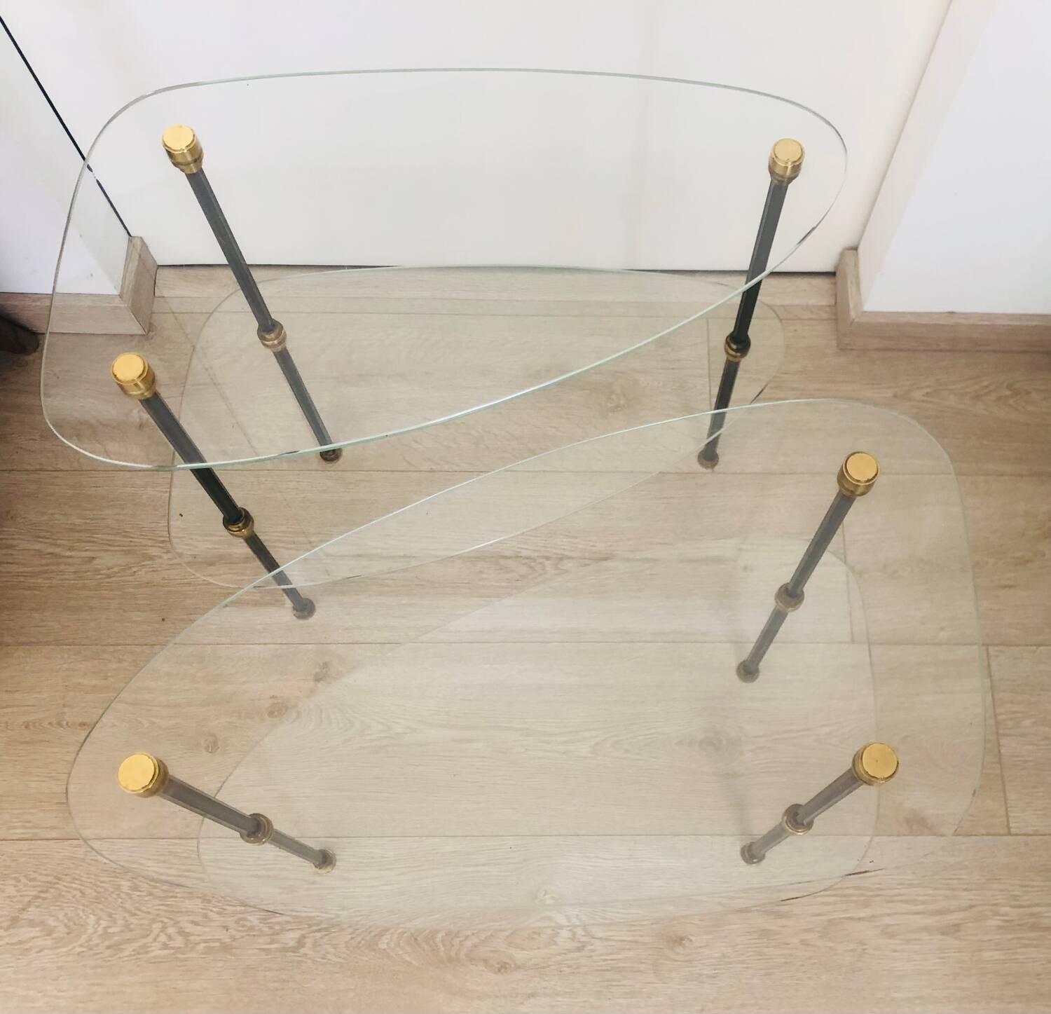 2 small side tables in glass and Bakelite with gold nuts from the 1960s.