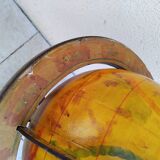 Old terrestrial globe world map on wooden stand
