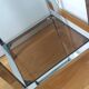 Chrome metal and smoked glass console
