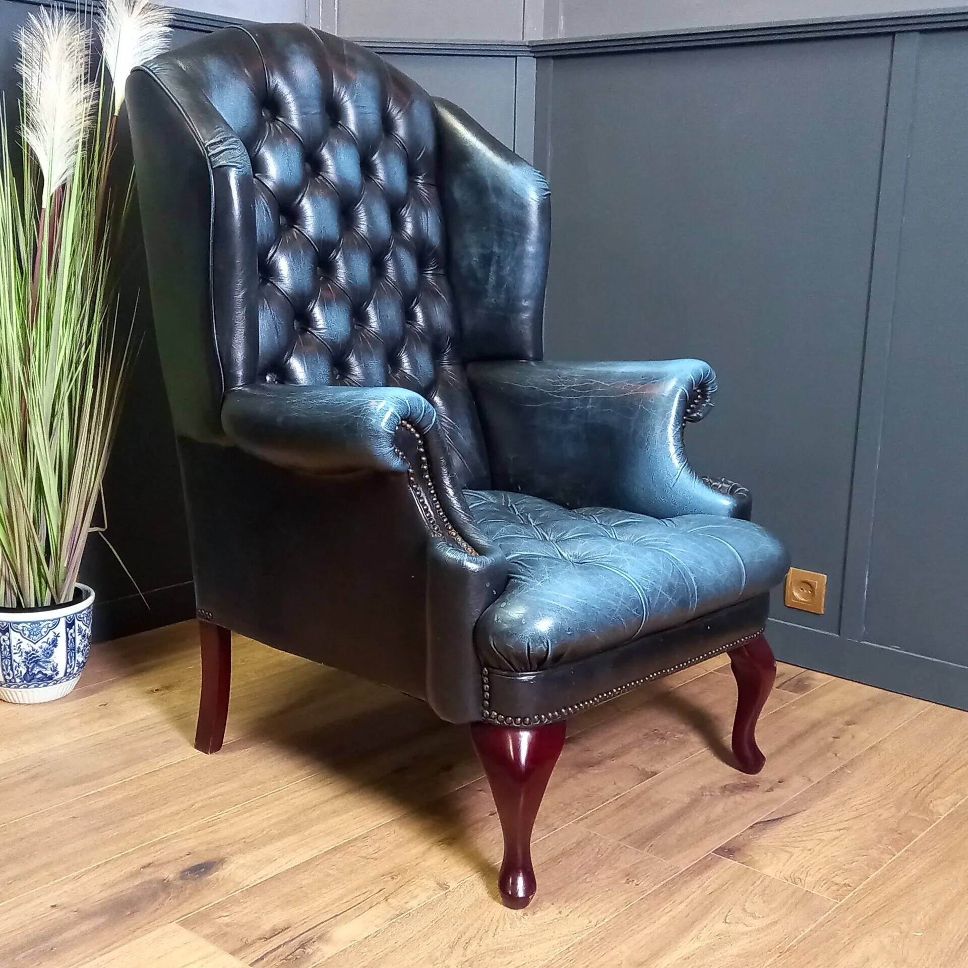 Blue chesterfield barrel back armchair