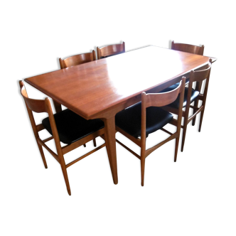 Table with two extensions and its 6 chairs scandinavian teak of the 1970s