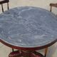 Empire guéridon in mahogany and marble, revolving top.