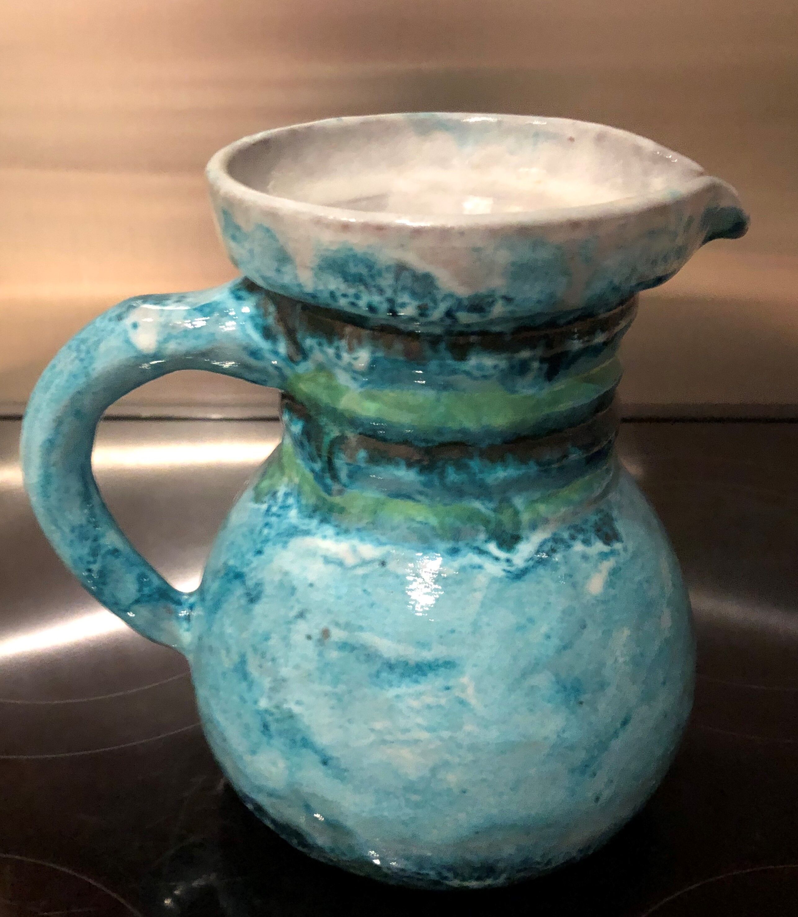 Old pitcher in terracotta signed