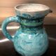 Old pitcher in terracotta signed