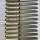 Series of 12 serrated vintage table knives