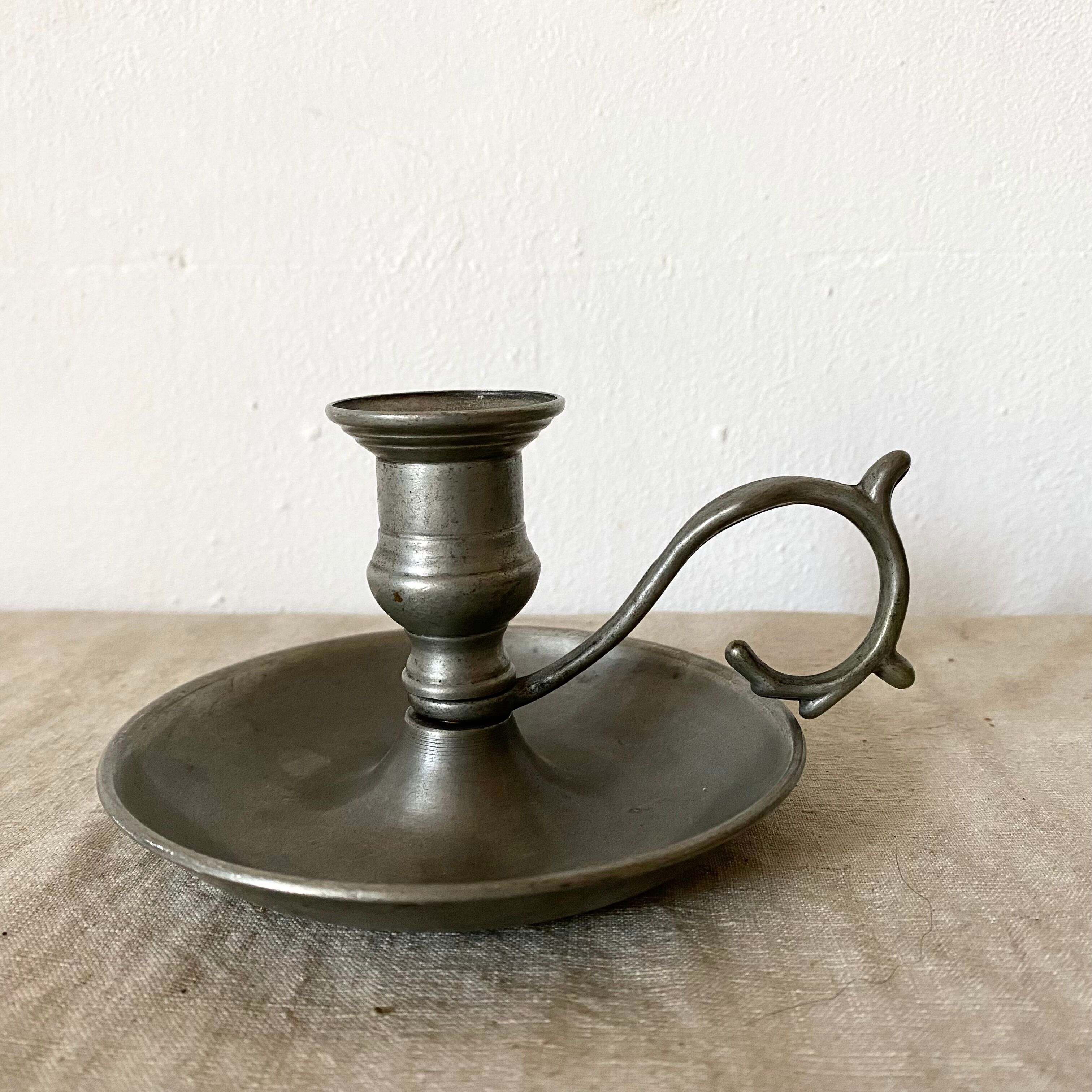 Tin thumb candle holder