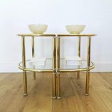 Pairs of gilded metal bedside tables and glass tops