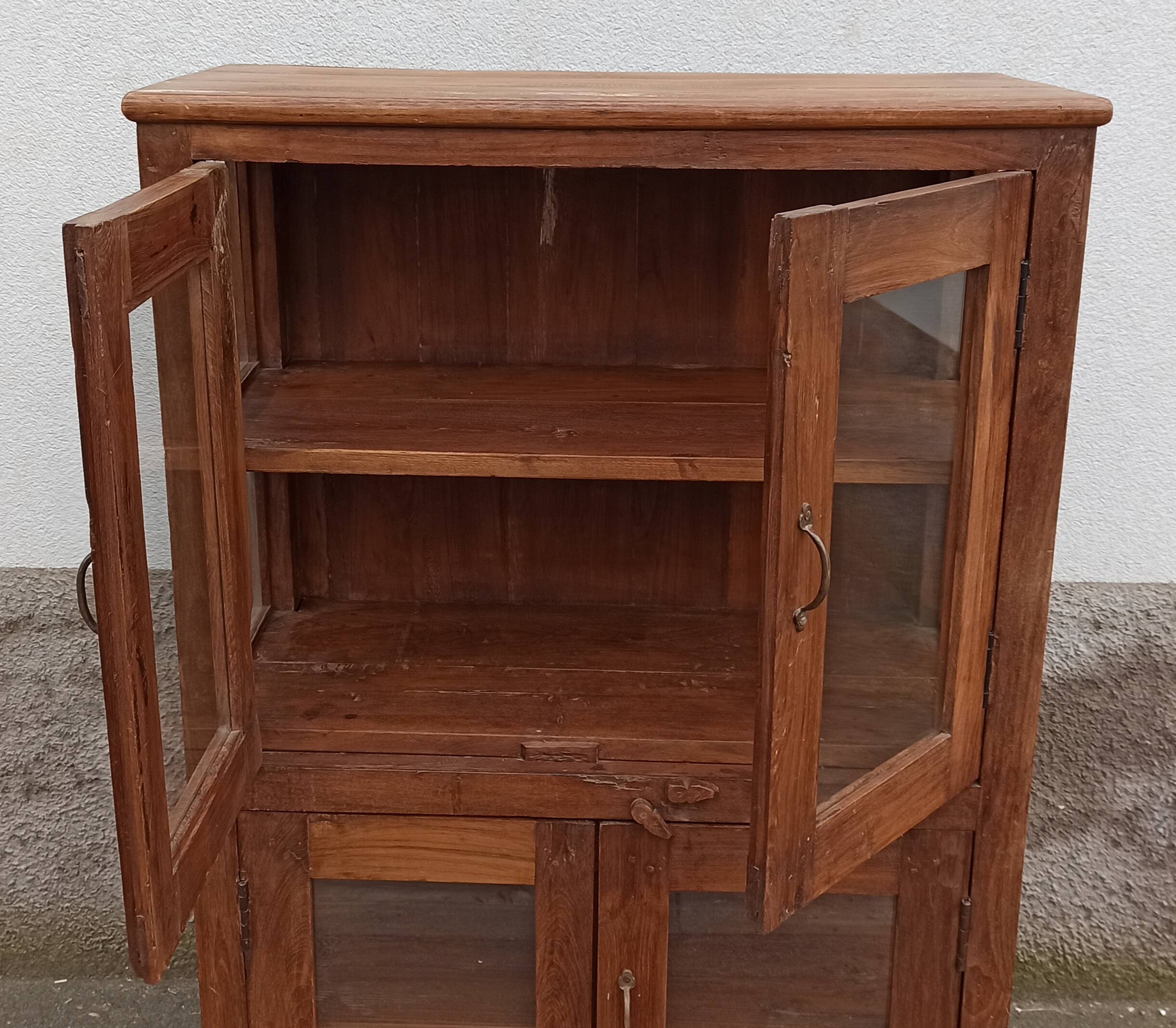 Old wooden display cabinet with three glazed sides