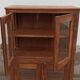 Old wooden display cabinet with three glazed sides