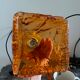 Set of two amber glass hanging lamps
