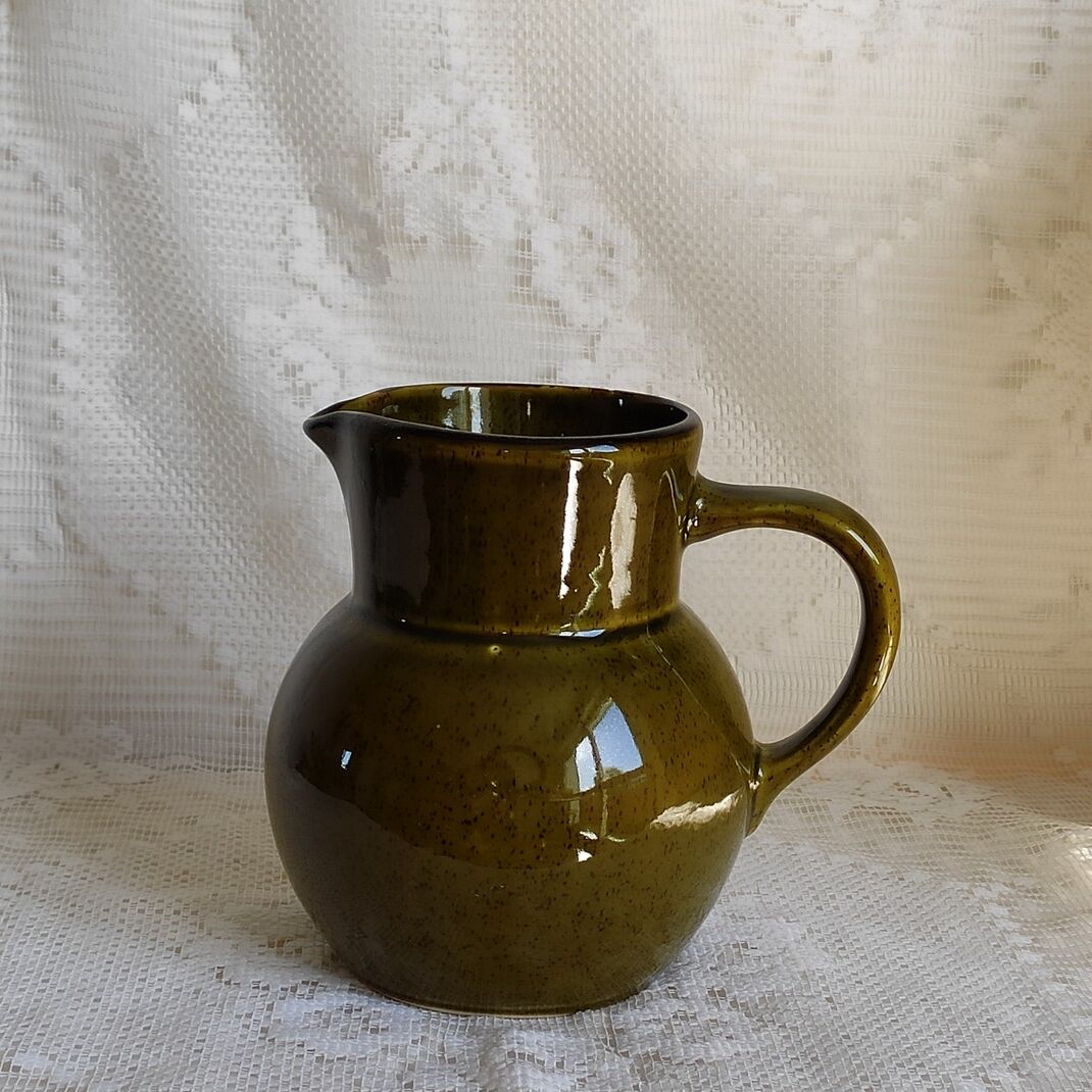 Green ceramic pitcher