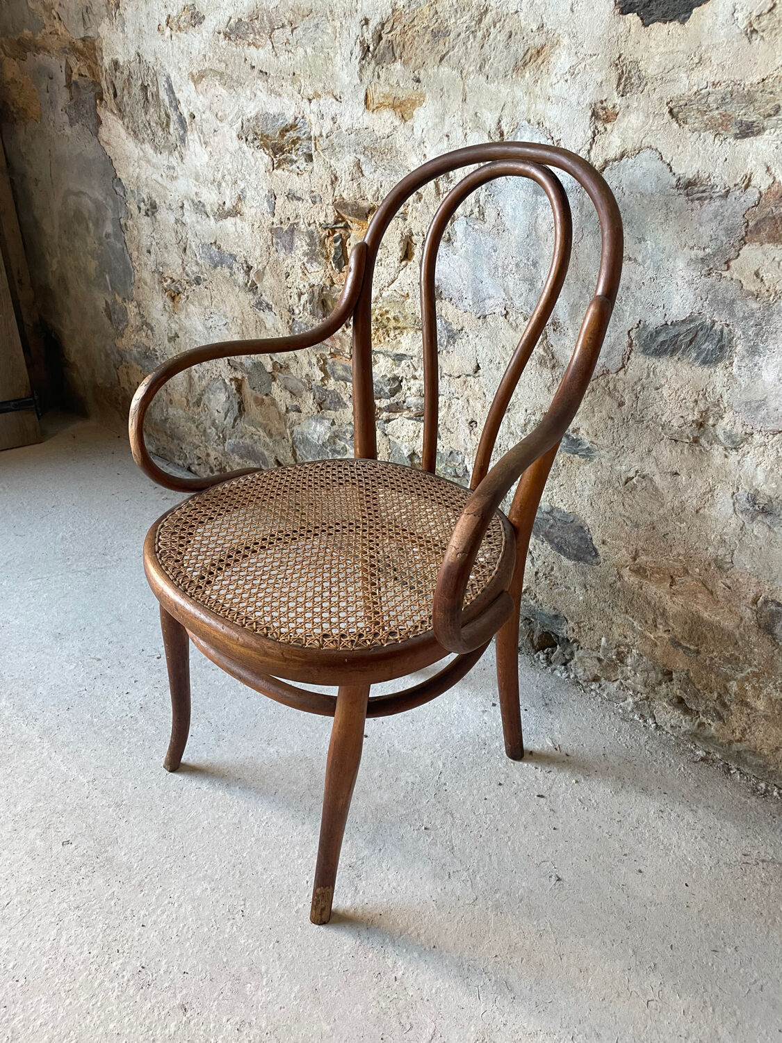 Thonet armchair with bent wood and caning