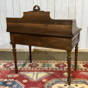 Louis XVI style desk from the late 19th century in walnut with a leather top.
