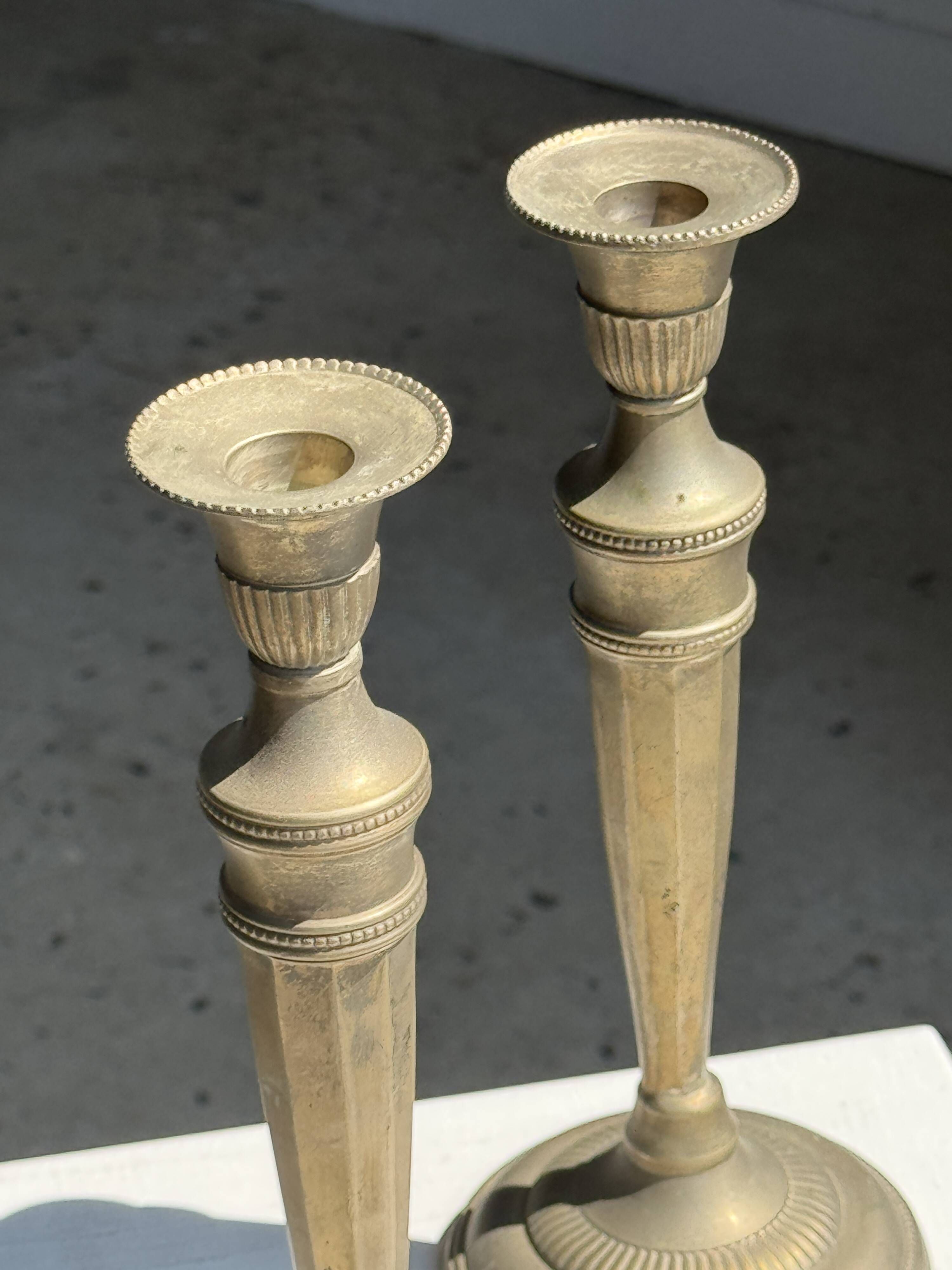 Pair of classic candlesticks in patinated gold metal H25