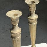 Pair of classic candlesticks in patinated gold metal H25