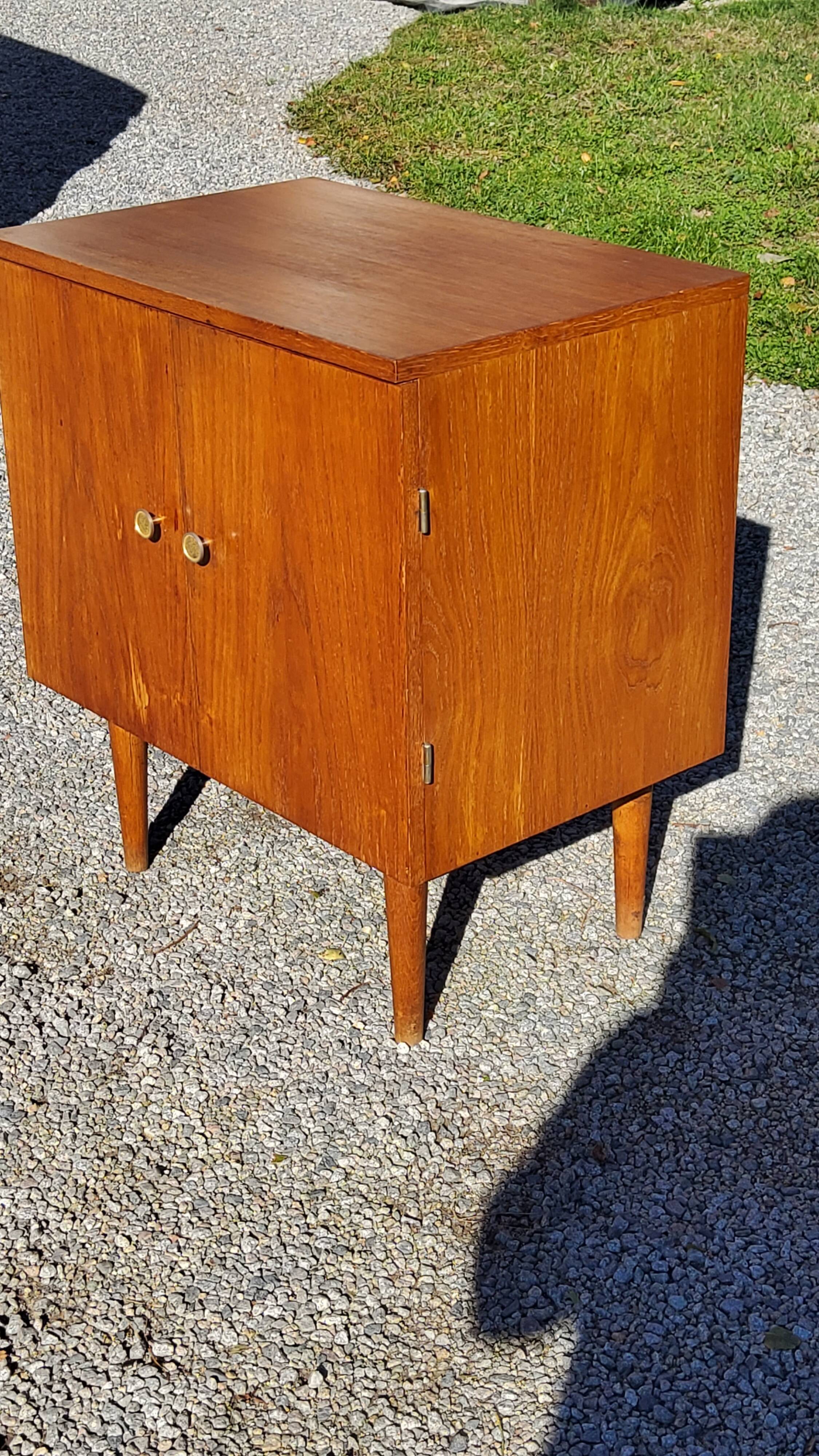Vintage golden oak sideboard with conical legs from the 1950s