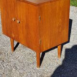Vintage golden oak sideboard with conical legs from the 1950s