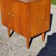 Vintage golden oak sideboard with conical legs from the 1950s