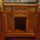 Empire style half-moon shaped mahogany bookcase with putti