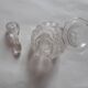 Cut crystal oil bottle with its crystal stopper.
