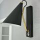 Pair of modernist sconces in black and gold metal