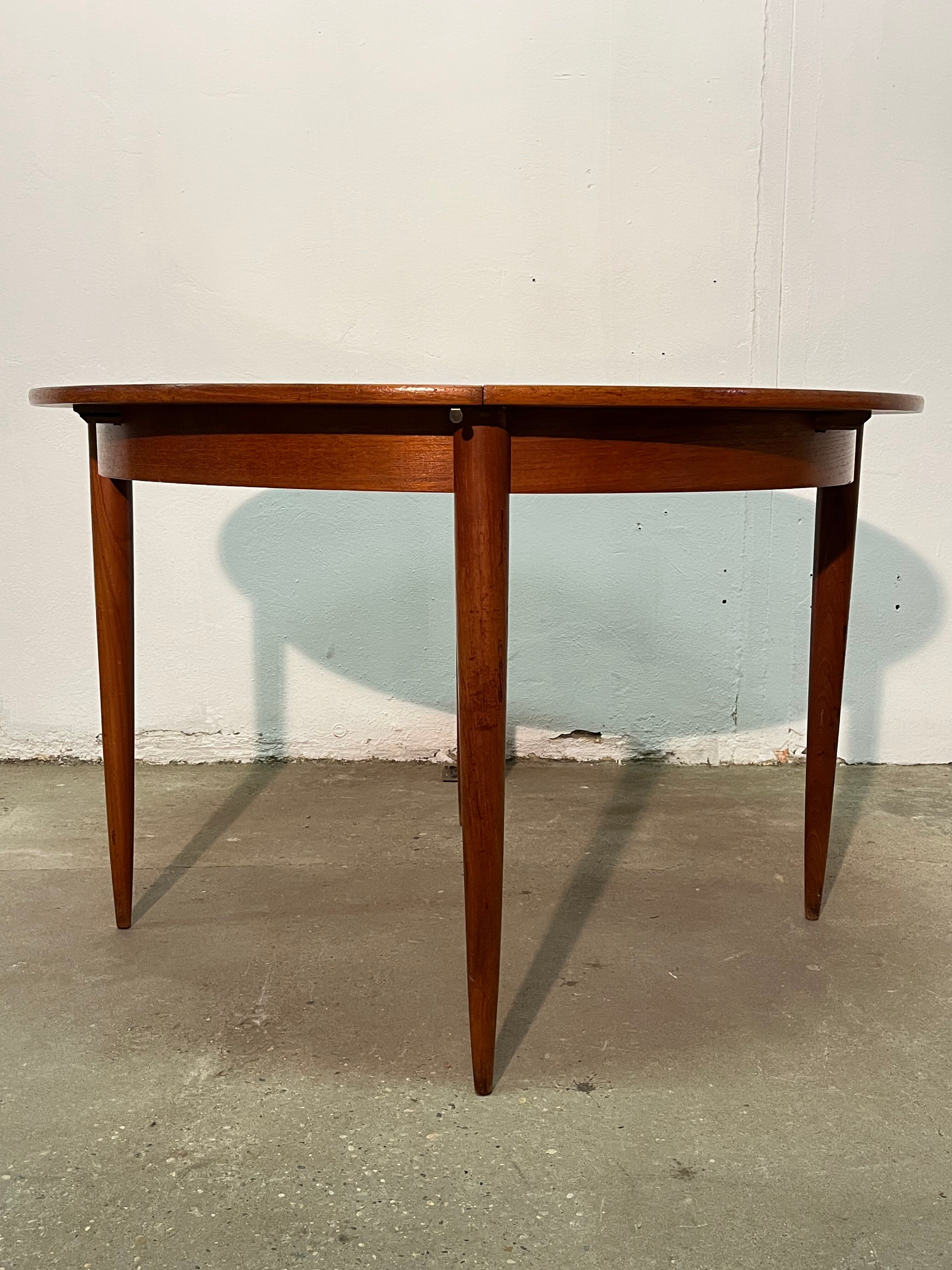Vintage 1960s teak extendable Scandinavian table.