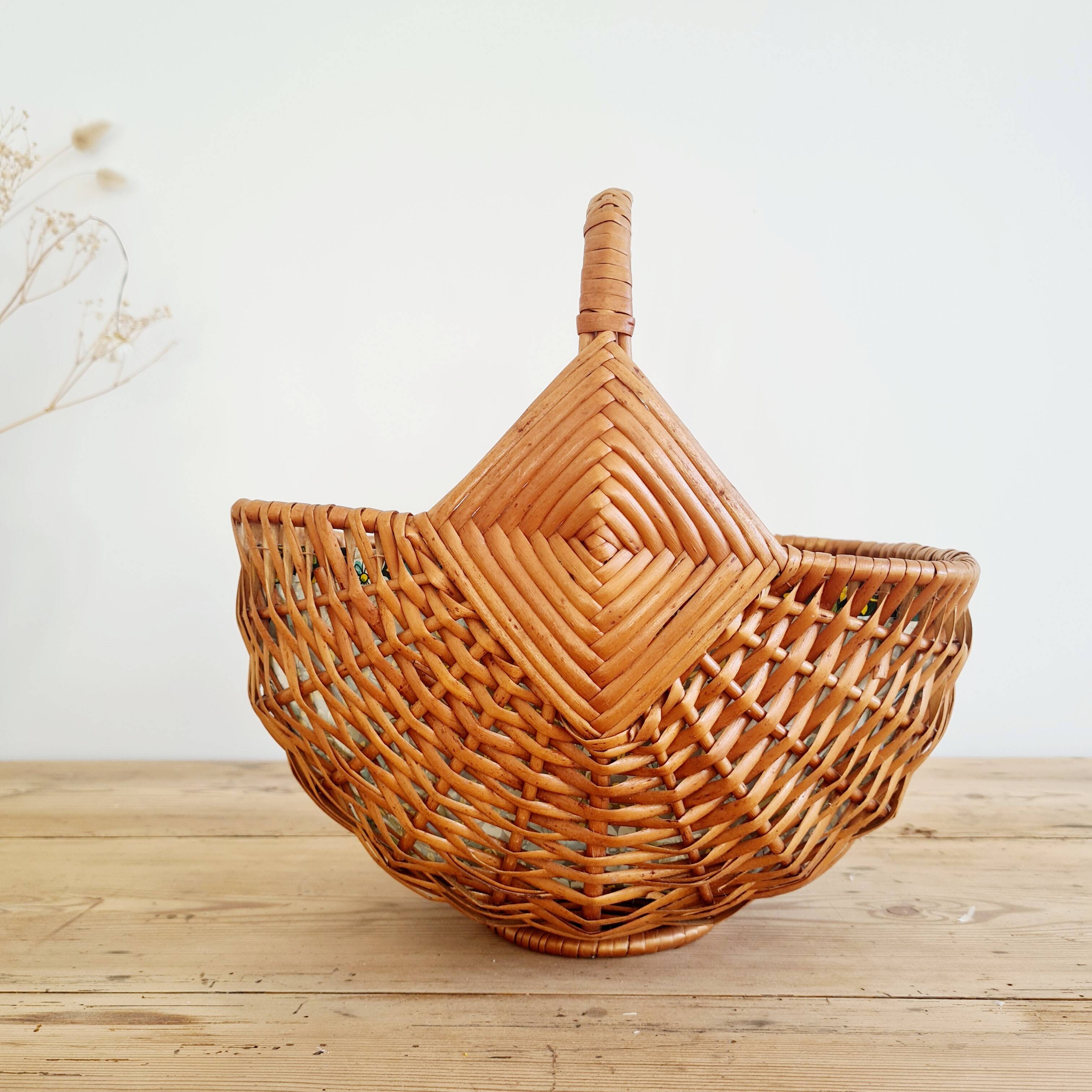 Small old basket with floral fabric interior