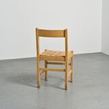 Set of six solid pine chairs by Maison Regain.
