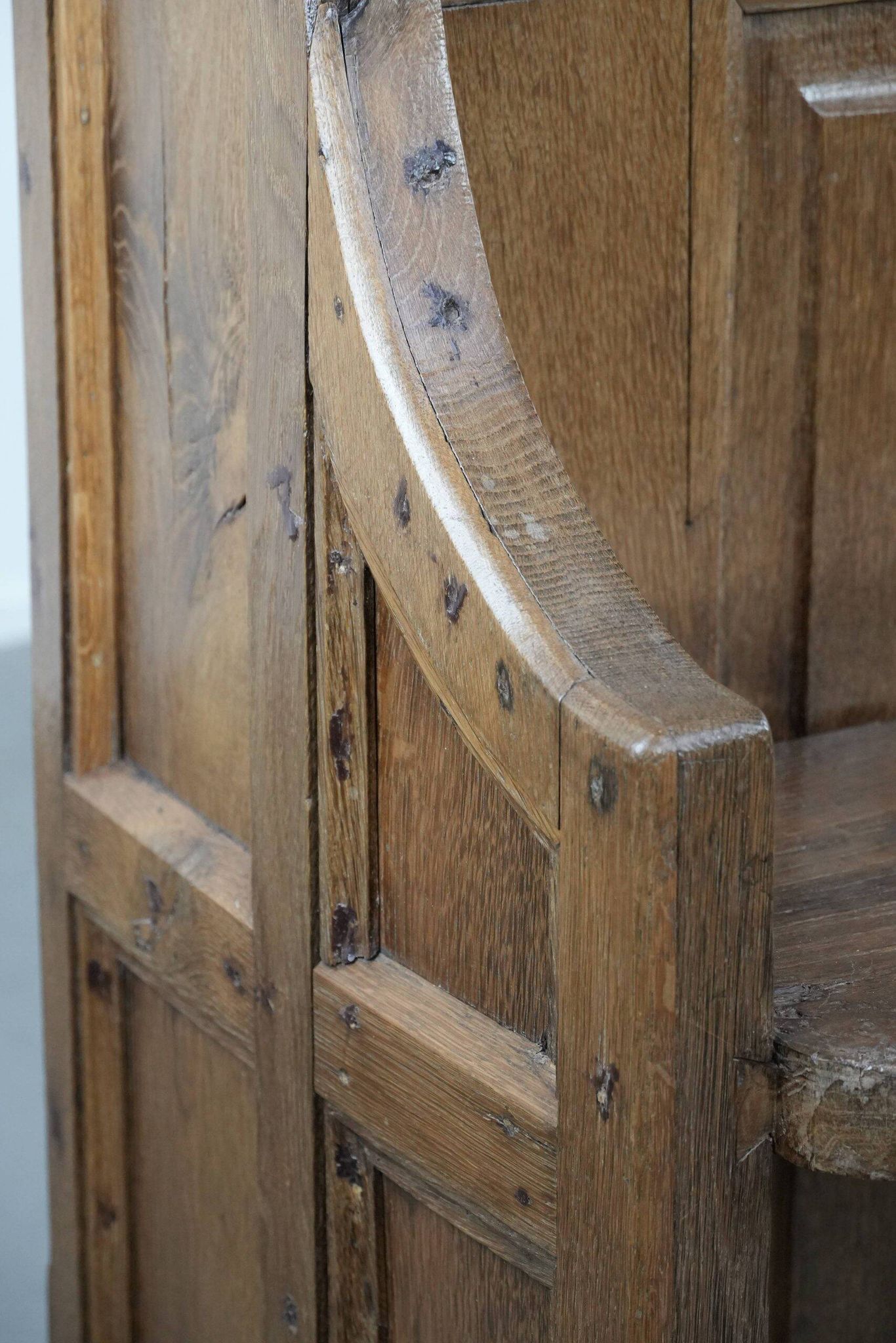 Antique oak church bench in Gothic style with beautiful wood carving