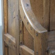 Antique oak church bench in Gothic style with beautiful wood carving