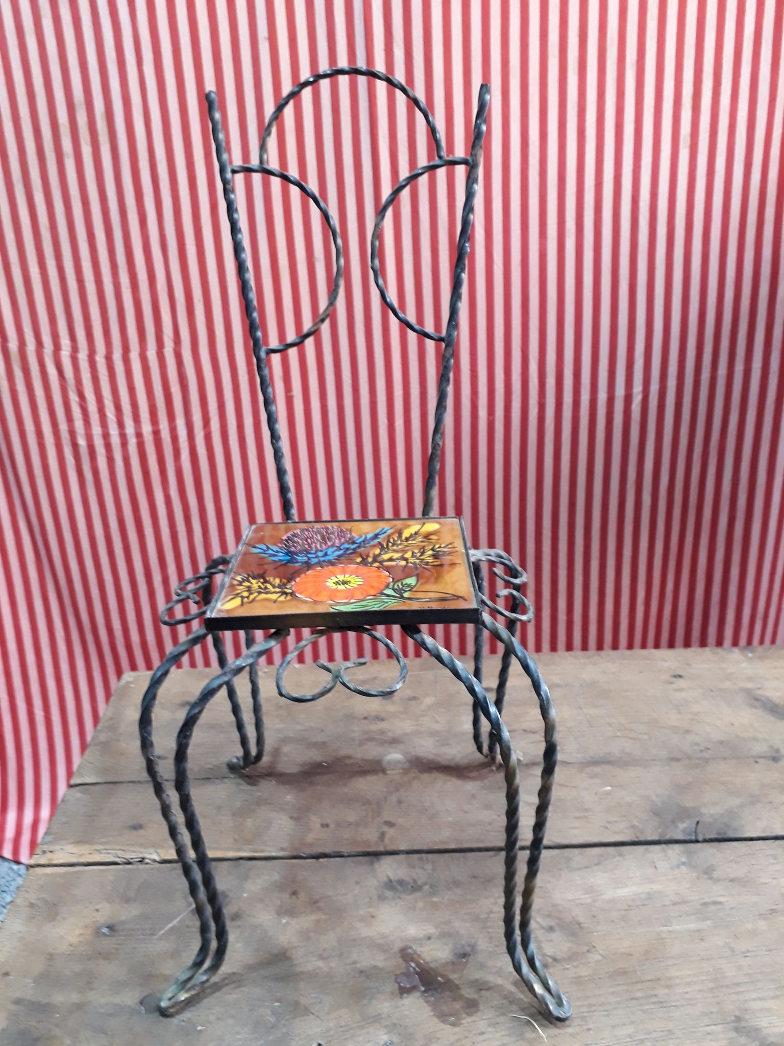 Wrought iron chair with enamelled plate signed Vallauris