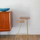 Small brass side table with a teak top, 1960.